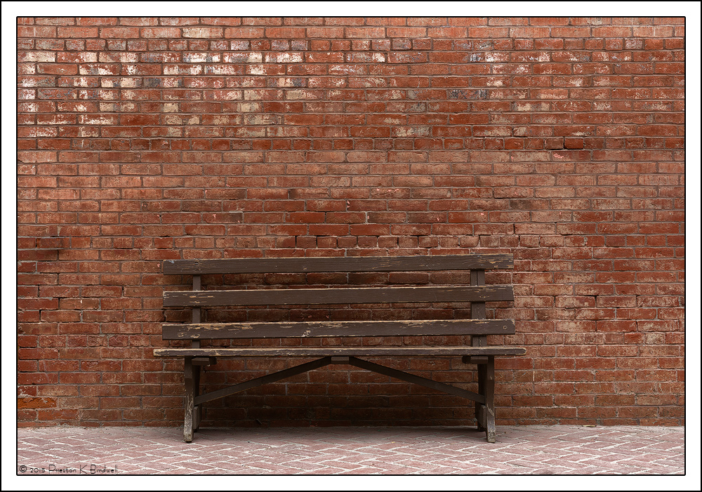 Bench & Brick Wall