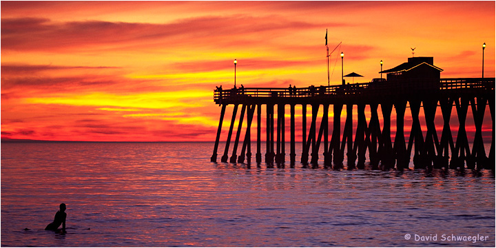 Surfer and San Clemente Pier at Sunset