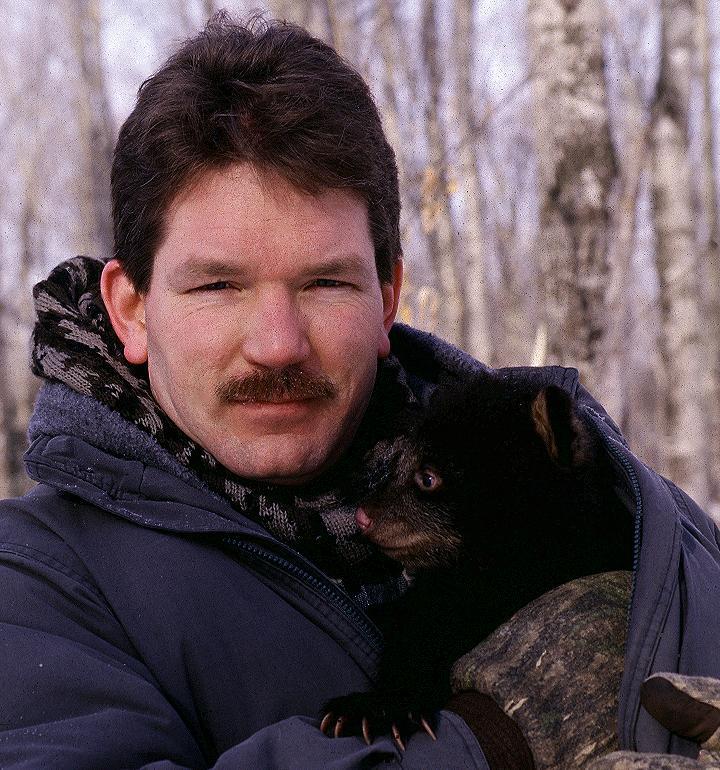 Steve Harryman with black bear cub